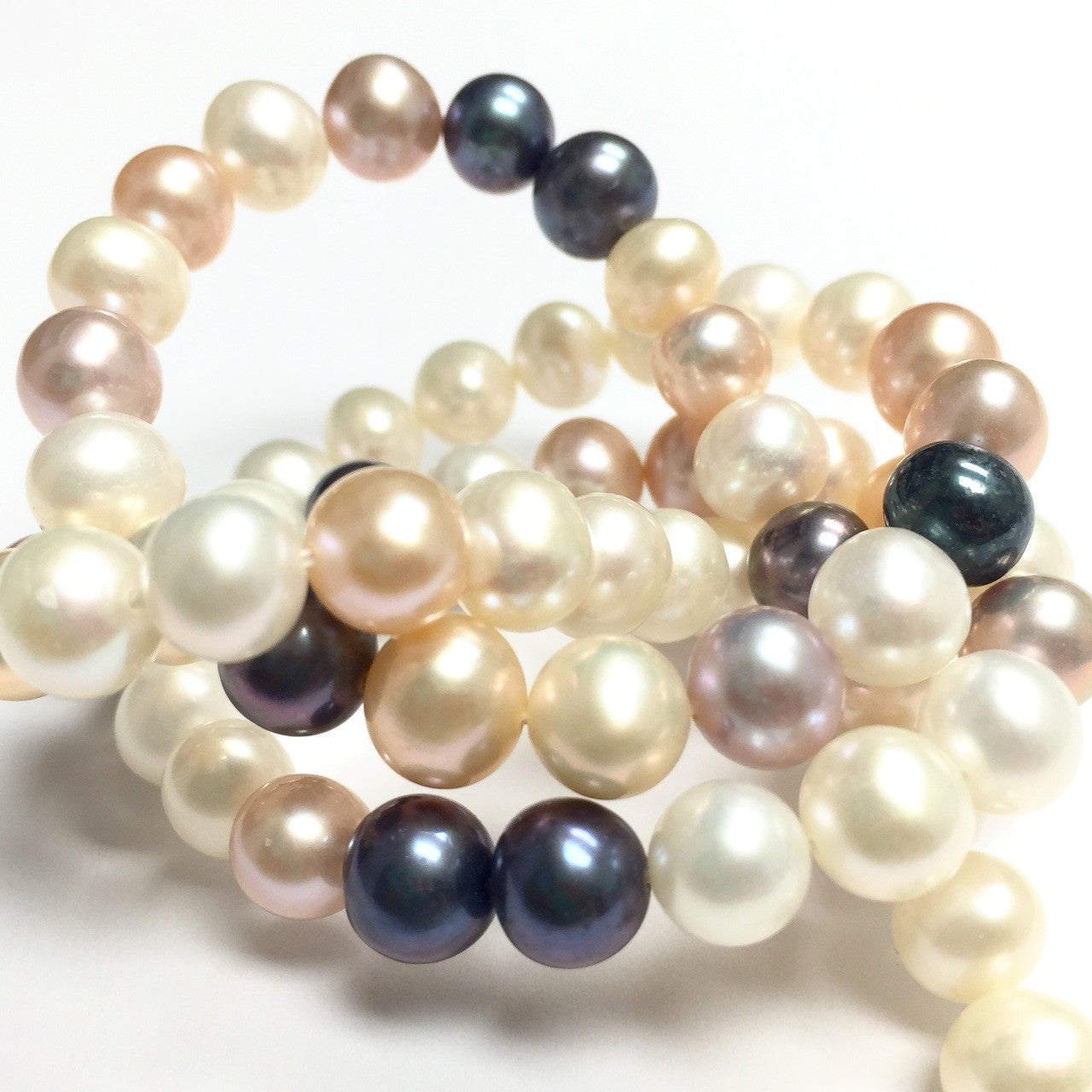 Freshwater Peach and White Potato Pearl Mix with a Hint of Peacock