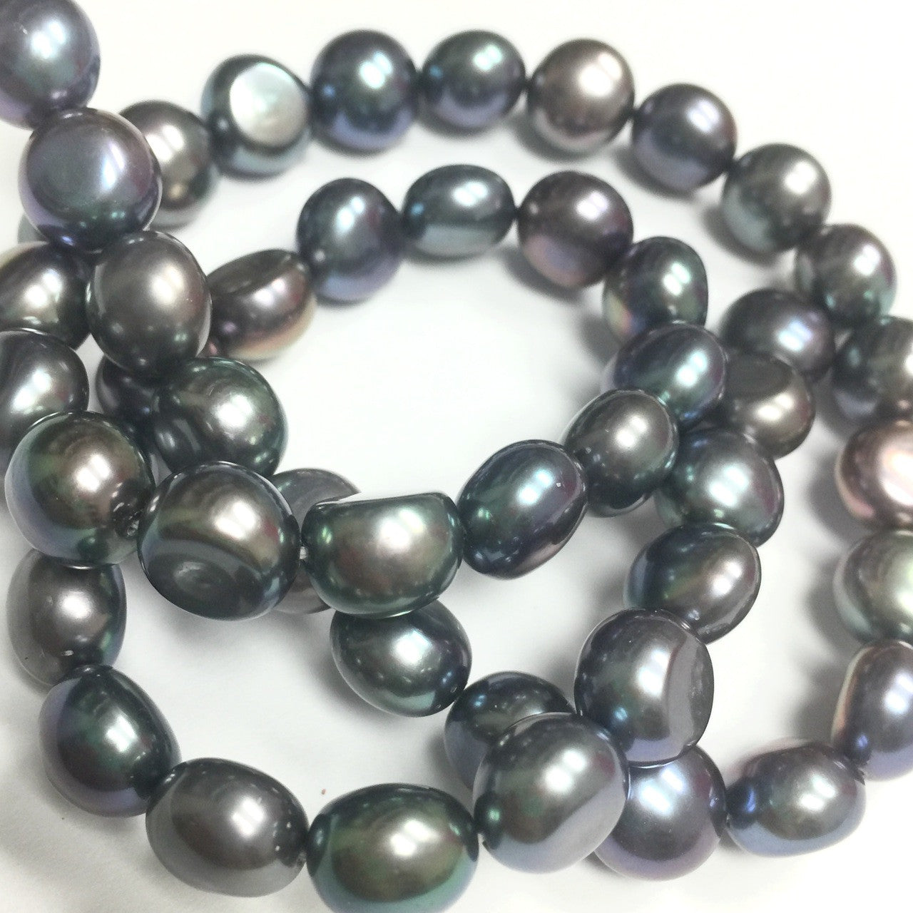 Freshwater Peacock Button Pearls