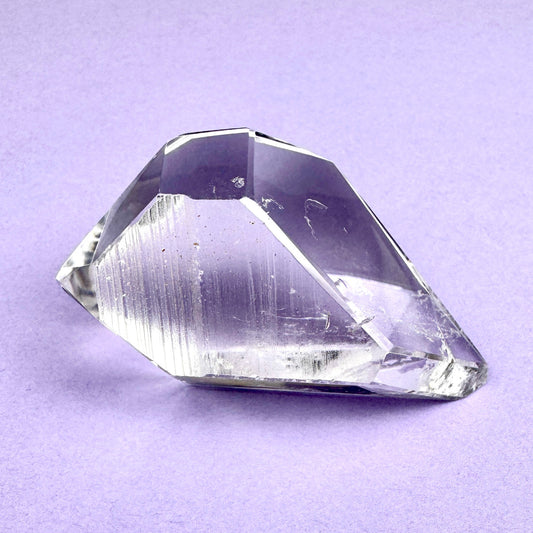 clear crystal with a faceted diamond shape