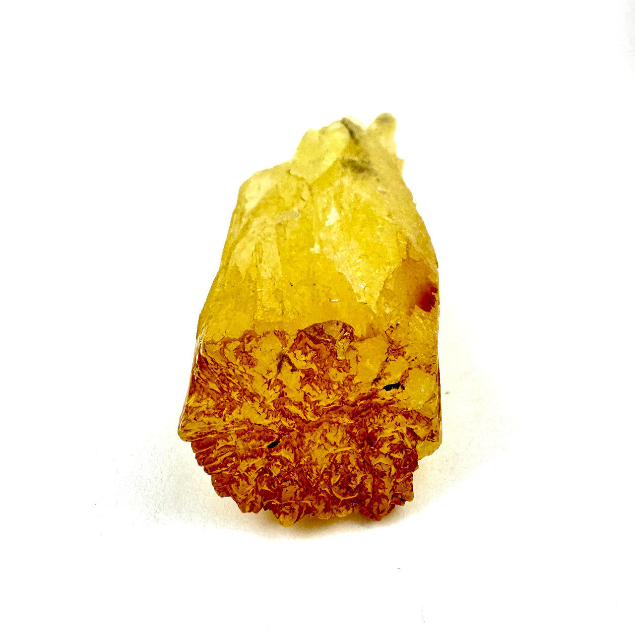 yellow crystal with a textured, reddish base, on a white background