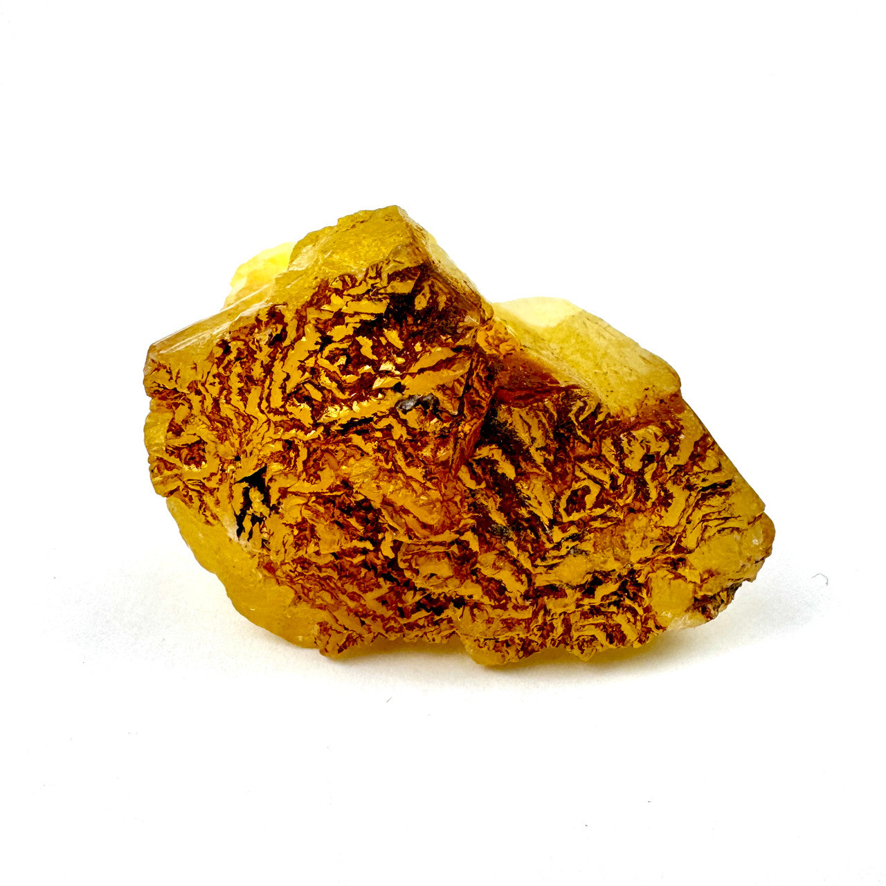 yellowish crystalline mineral with rough, textured surface