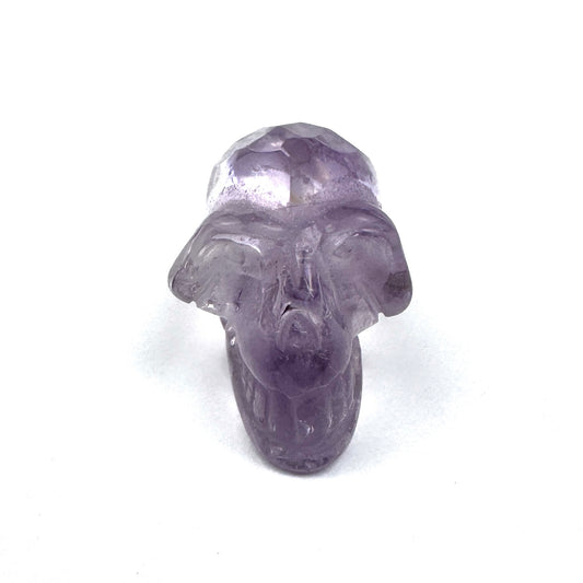 carved amethyst skull figurine