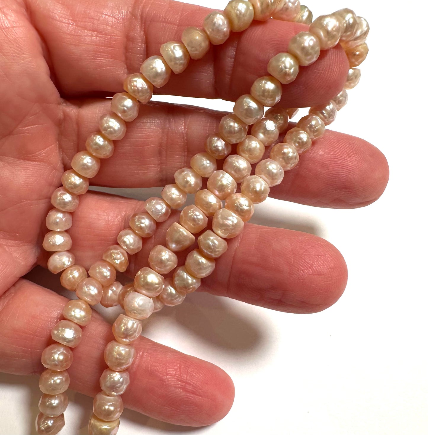 Faceted Peachy Pink Button Pearls – 6mm Strand – PB7857