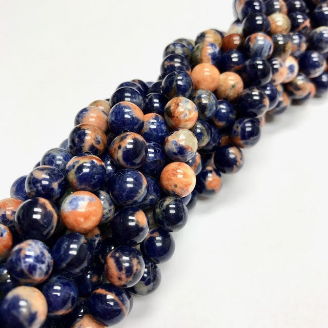 A Grade Orange Sodalite Highly Polished Round Beads