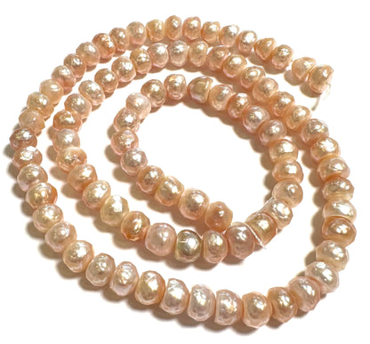 Faceted Peachy Pink Button Pearls – 6mm Strand – PB7857